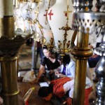 Pilgrims kiss and touch the Stone of Anointing